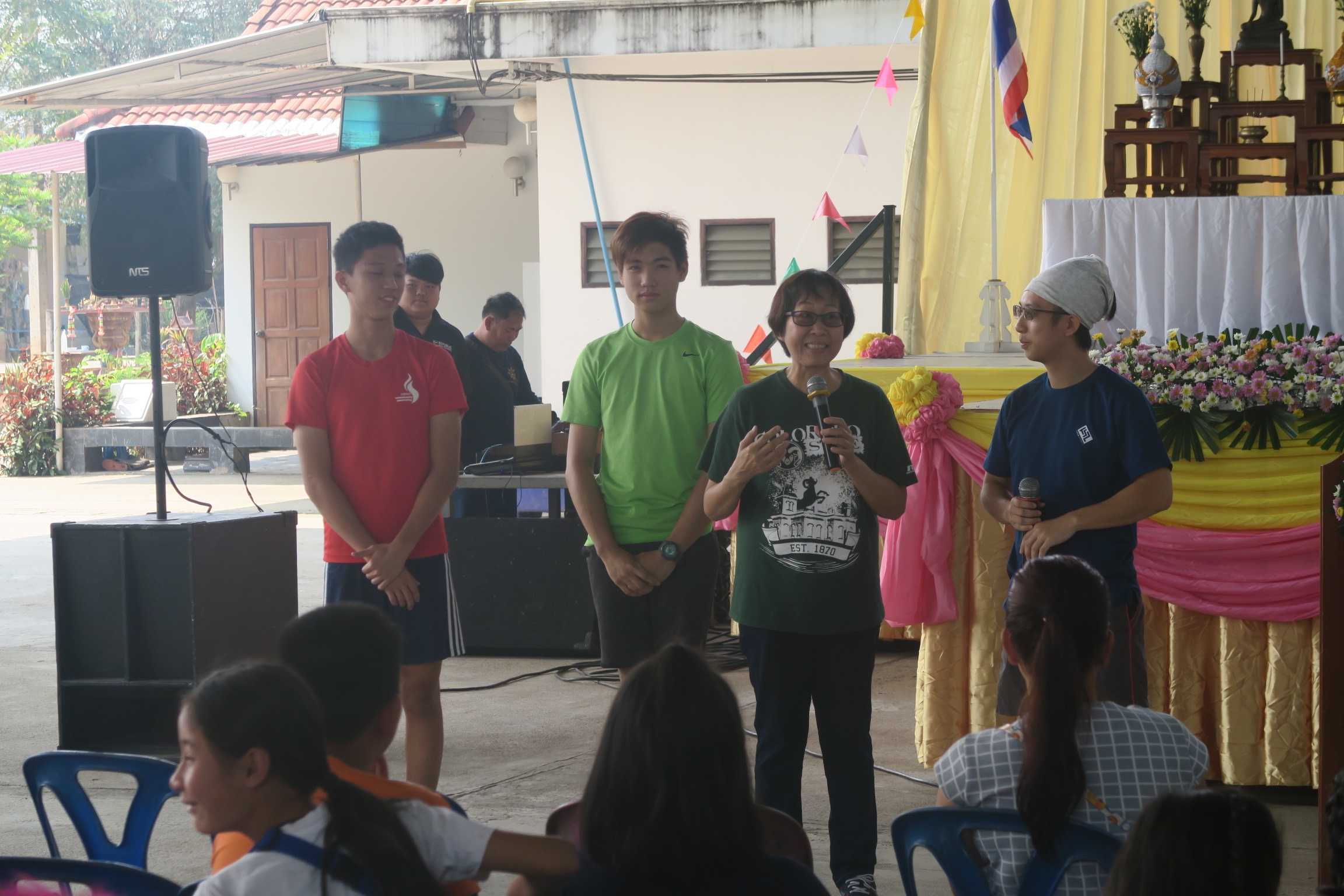 Preparing a skit on the gospel at a community carnival.