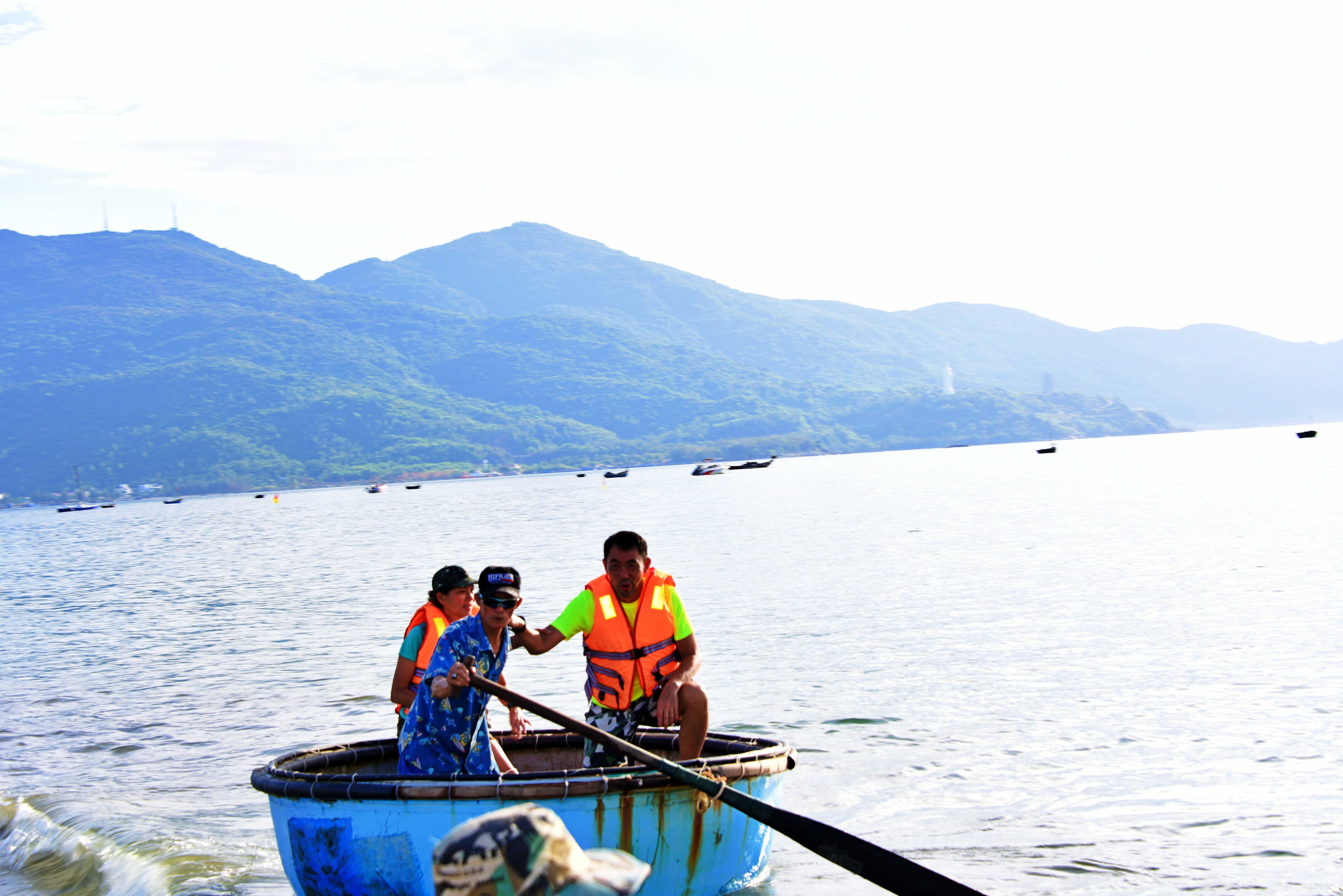 Tuck Meng steering the local fishing boat