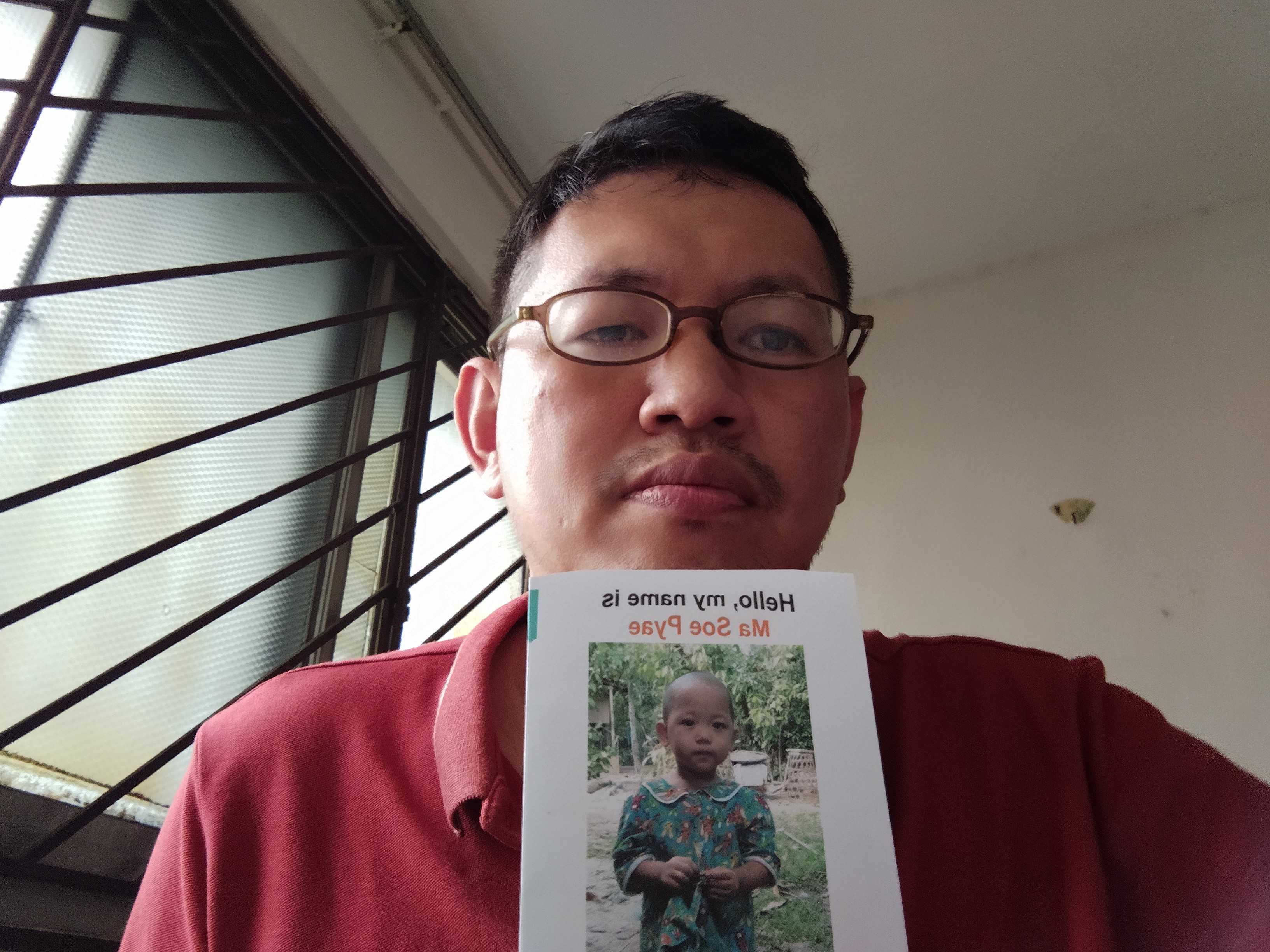Chun Hian with the child profile of his new sponsored child
