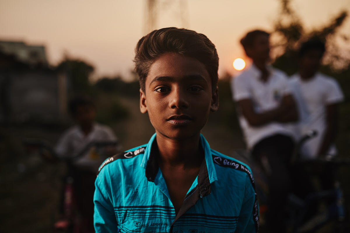 Children may not be used to smiling or comfortable in front of the camera