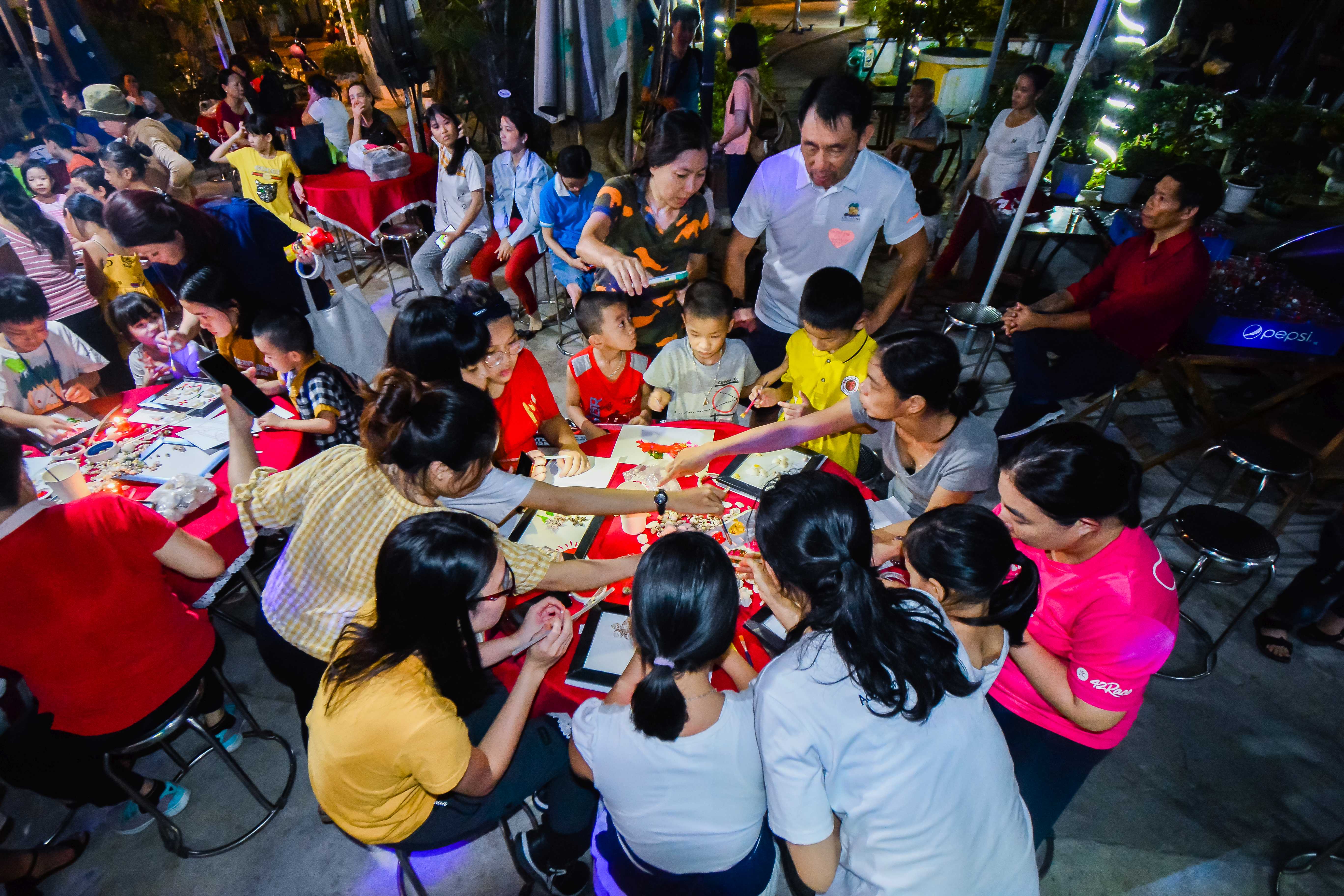 Sponsors and children partaking in activities together