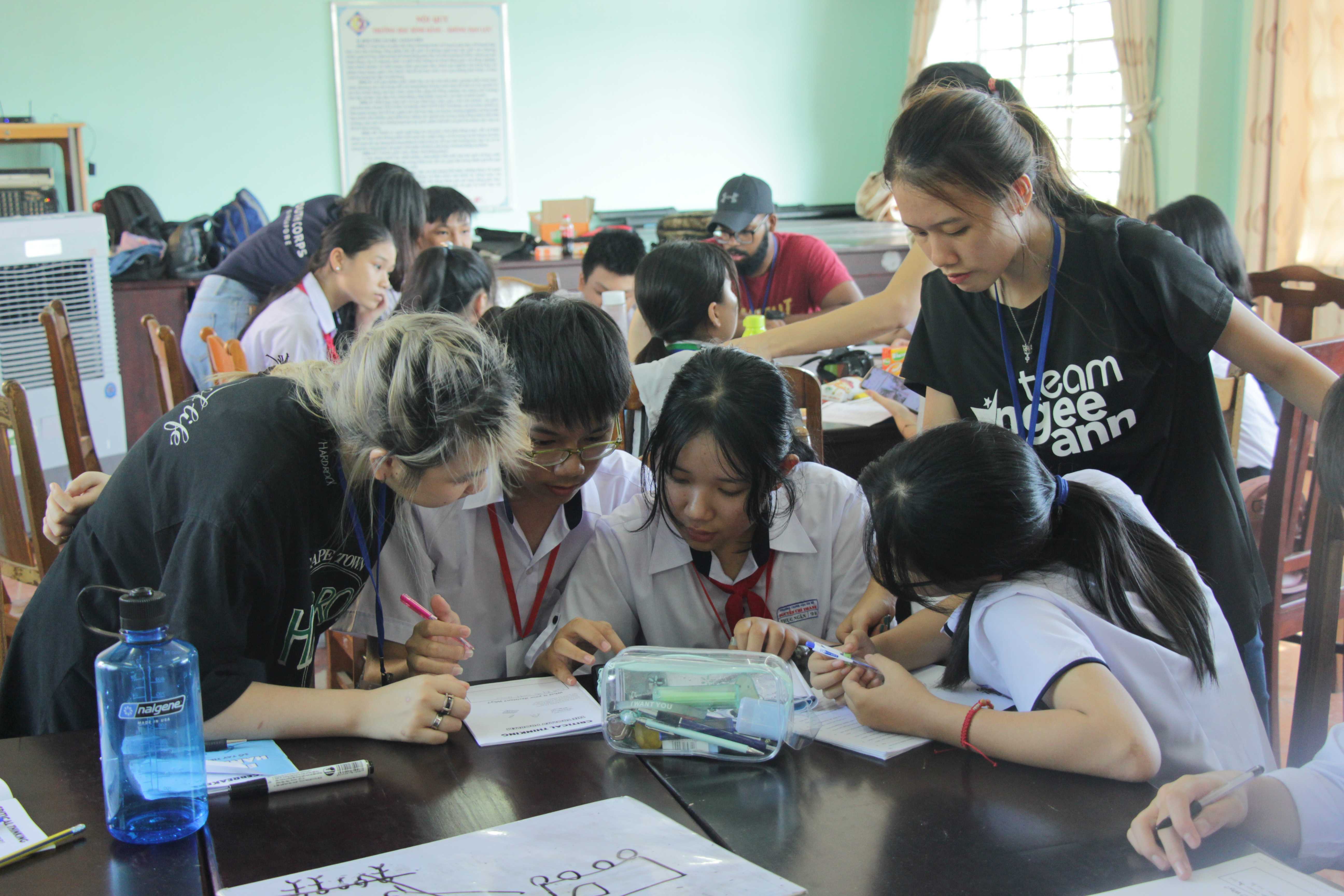 Facilitators helping teach students at the Advanced English Workshop!