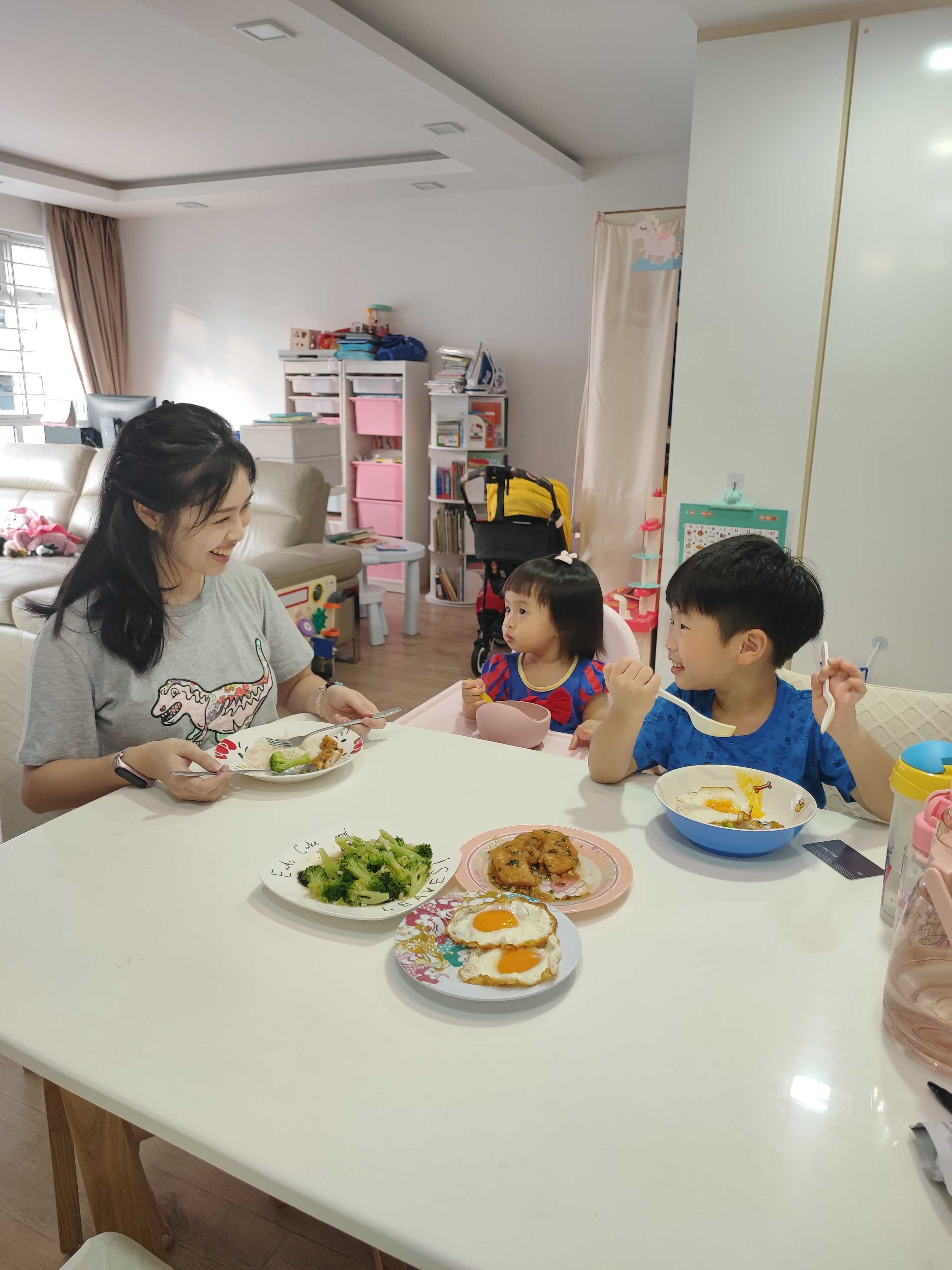 Mandy enjoying a meal with her 2 children