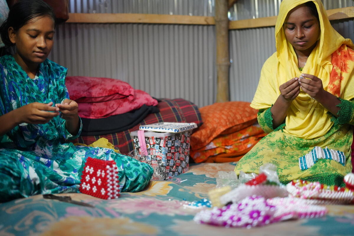 Akhi and her sister making bags