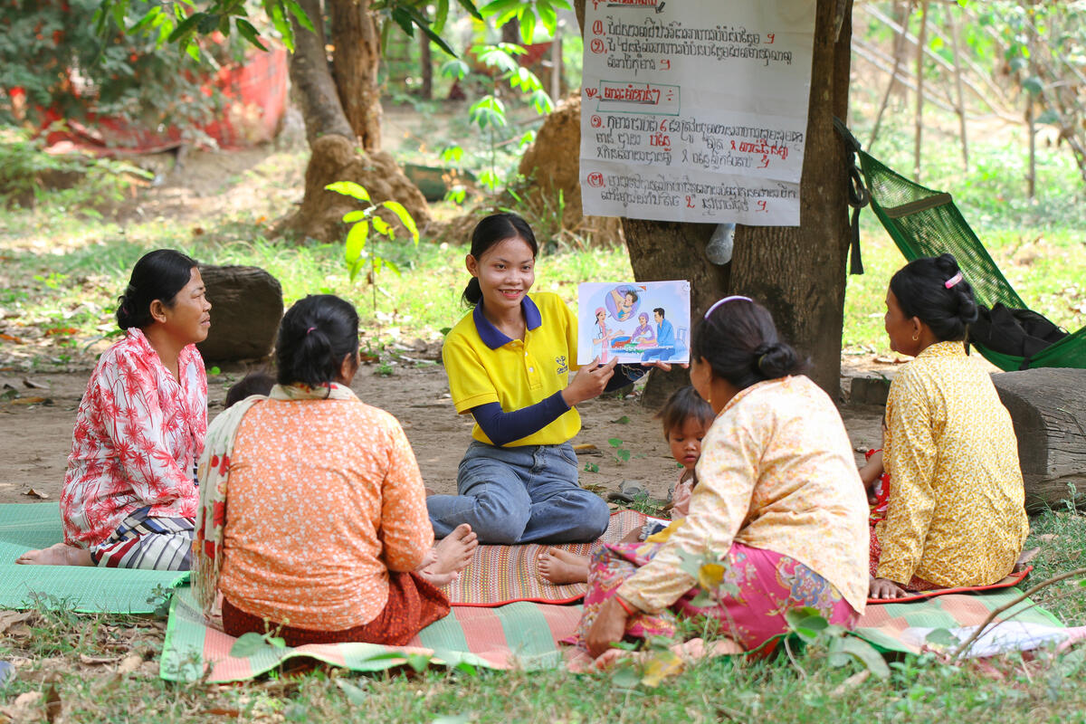 World Vision staff creating awareness on caring for children