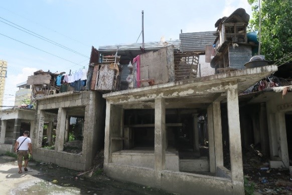 Informal settlers in Cebu set up makeshift homes in cemetaries.