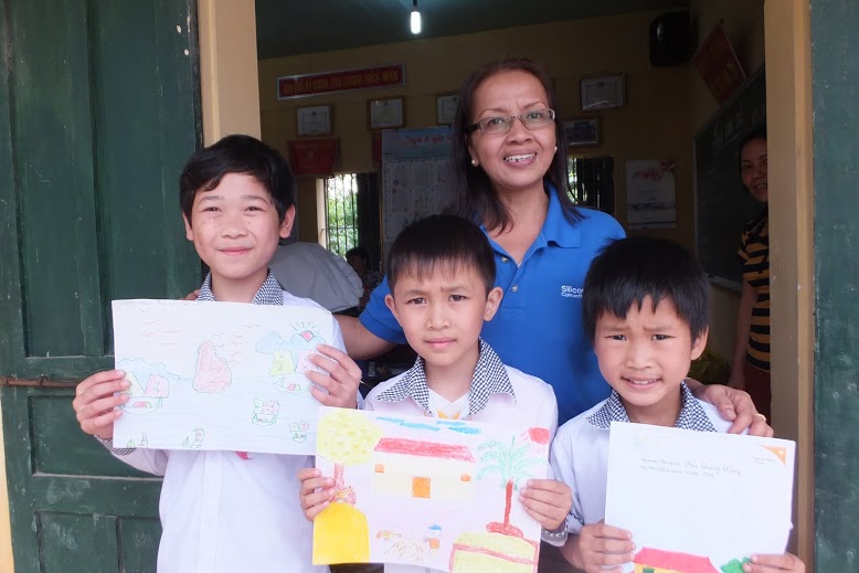 Hannah, a Silicon Connection staff, with the children she visited in Vietnam during a Child Sponsorship trip