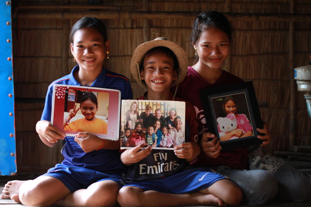 Sponsored children with gifts from their sponsors 