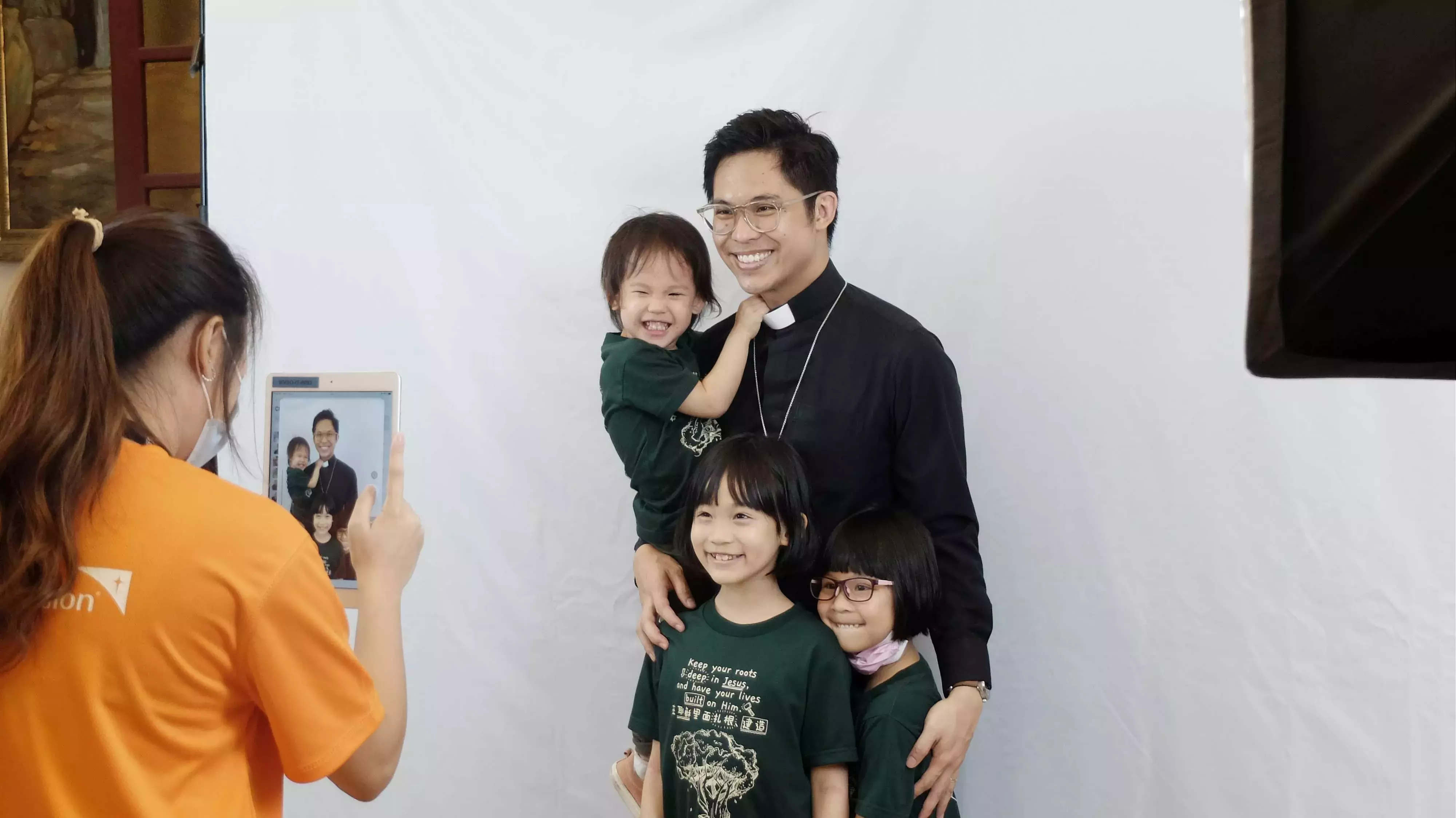 Pastor and son getting their photo taken as part of Chosen programme