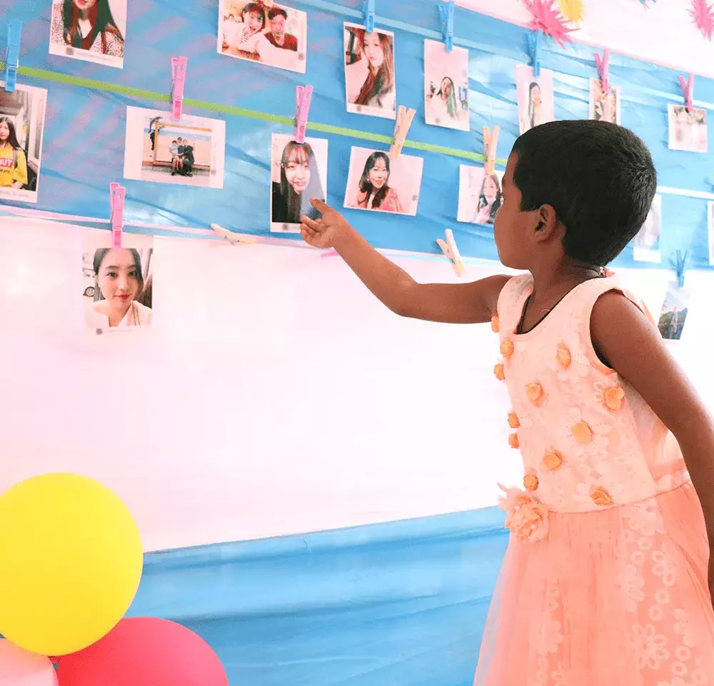 Child choosing sponsor photo at choosing party