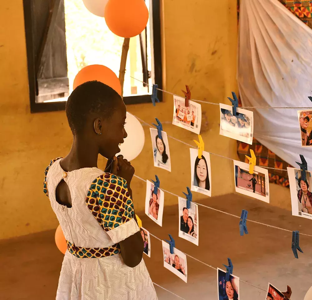 Child choosing sponsor photo at choosing party