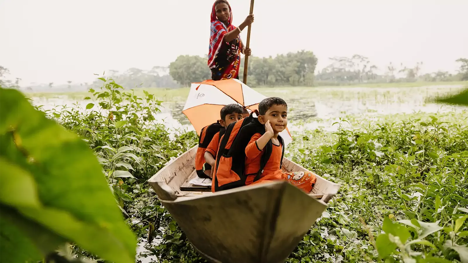 Children on a boat in Wazirpur Bangladesh
