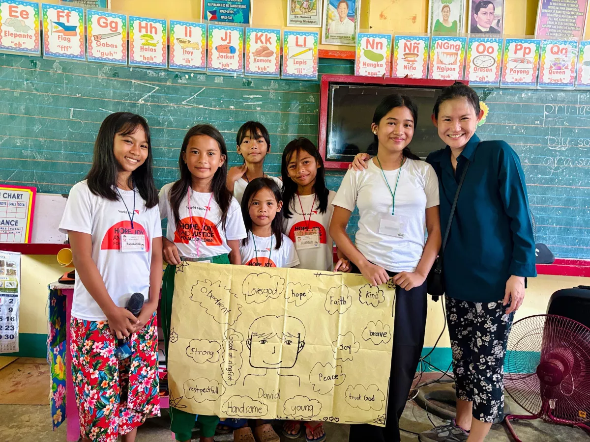 Jessica engaging the children on how they can also play a part in courage and hope to uplift the community