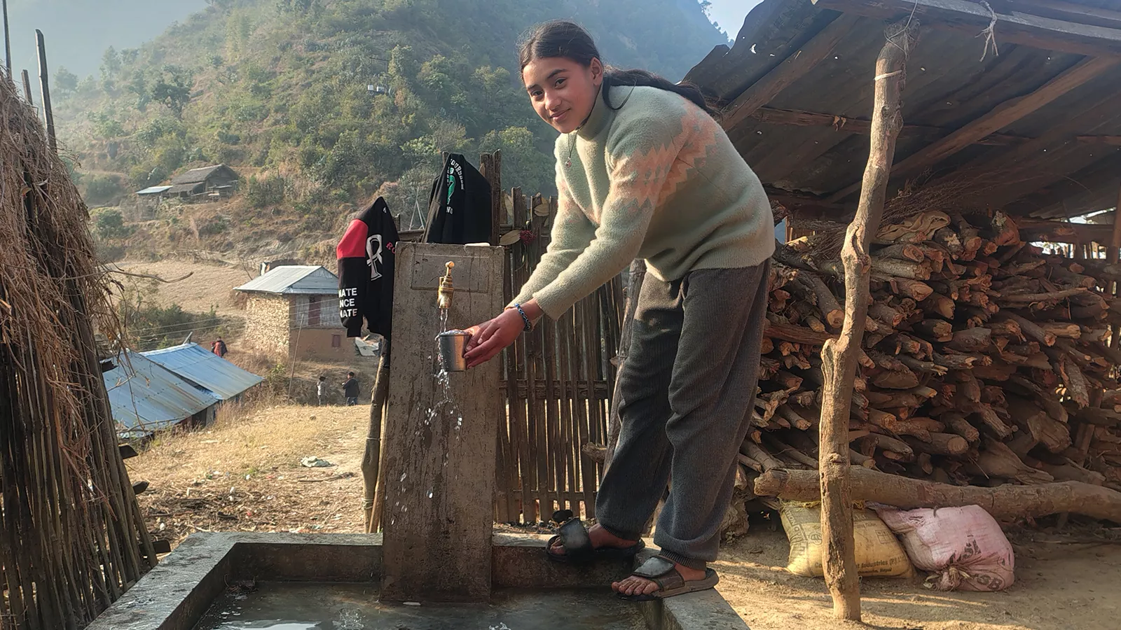 12 year old Bhesh Kumari having clean water