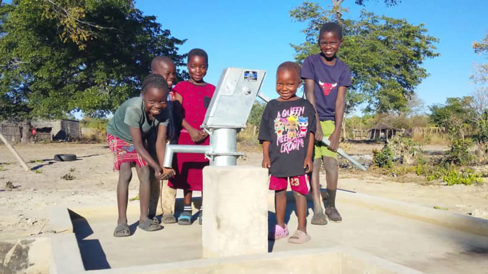Children washing their hands after a day's play