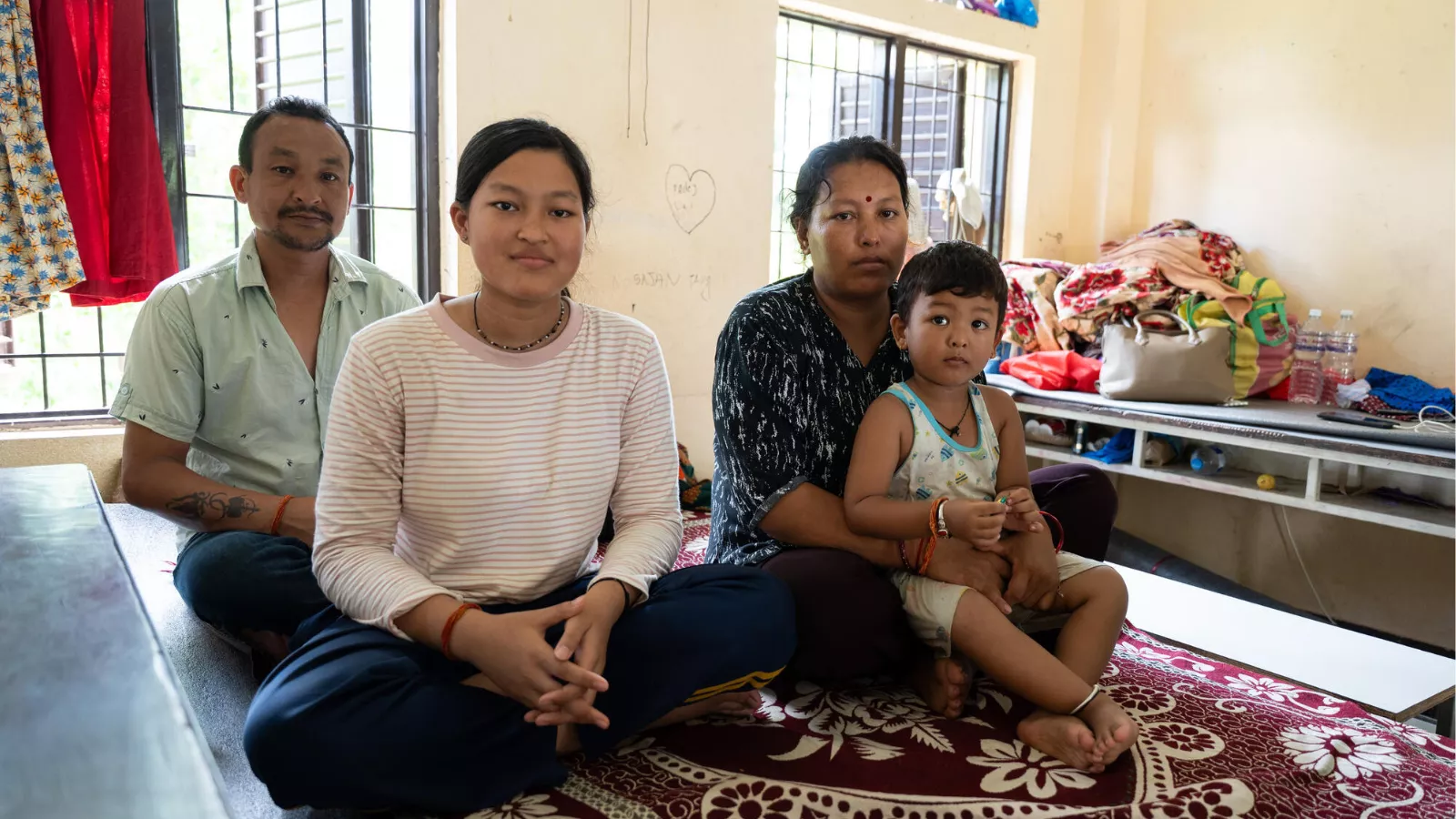 Suvekcha, her family and her 3-year-old brother at an evacuation centre in Nuwakot
