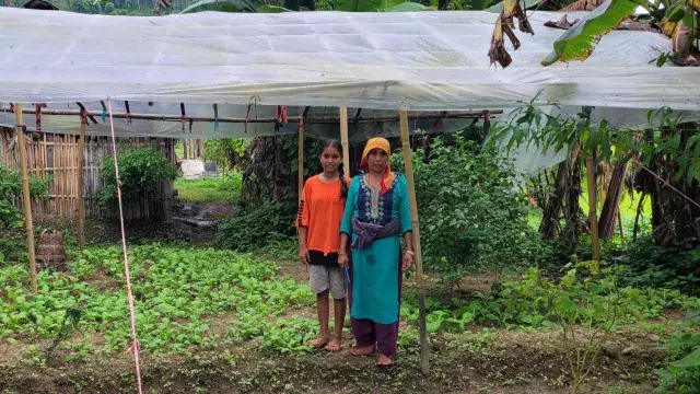mother and child in their vegetable garden in Nepal