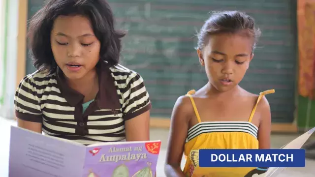 Children reading books in classroom with dollar match label