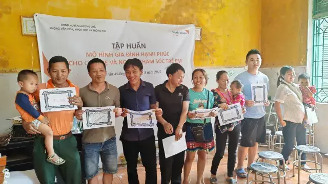 Parents attending a parenting workshop in Muong Cha.